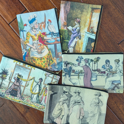 Colorful zipper pouches printed with historical prints from satirical papers from the 19th and 18th centuries. Virgil's Fine Goods