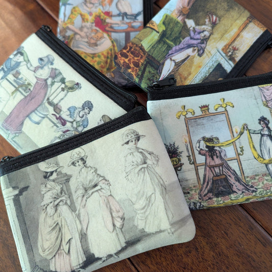 Small colorful zipper pouches printed with historical prints from satirical papers from the 19th and 18th centuries. Virgil's Fine Goods